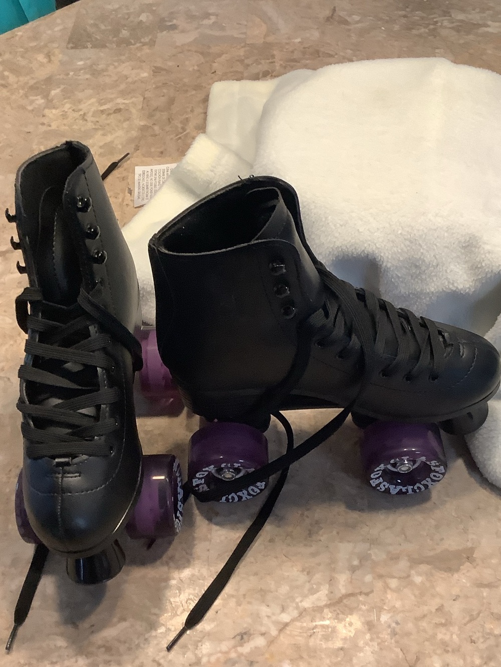 Black Quad Roller Skates with Purple Wheels